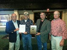 Mike Sandifer accepting the Open Shooting Dog award with Purina rep. Jerry Cascio, outgoing President Doug Meyer and VP Tim Penn.