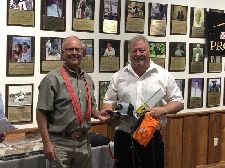 President Ken Sauer (left) with one of many raffle prize winners.