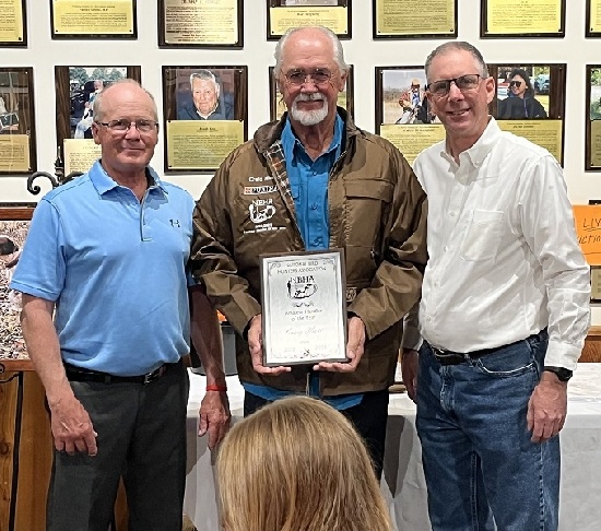 Amateur Handler of the Year Craig Hiatt accepting his plaque and commemorative custom jacket.